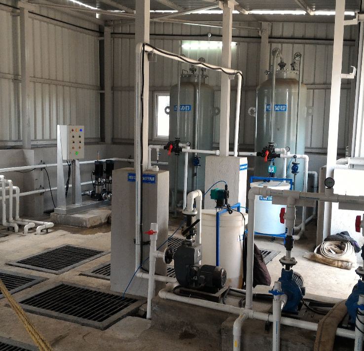 Indoor filtration plant with control panel and dosing pumps